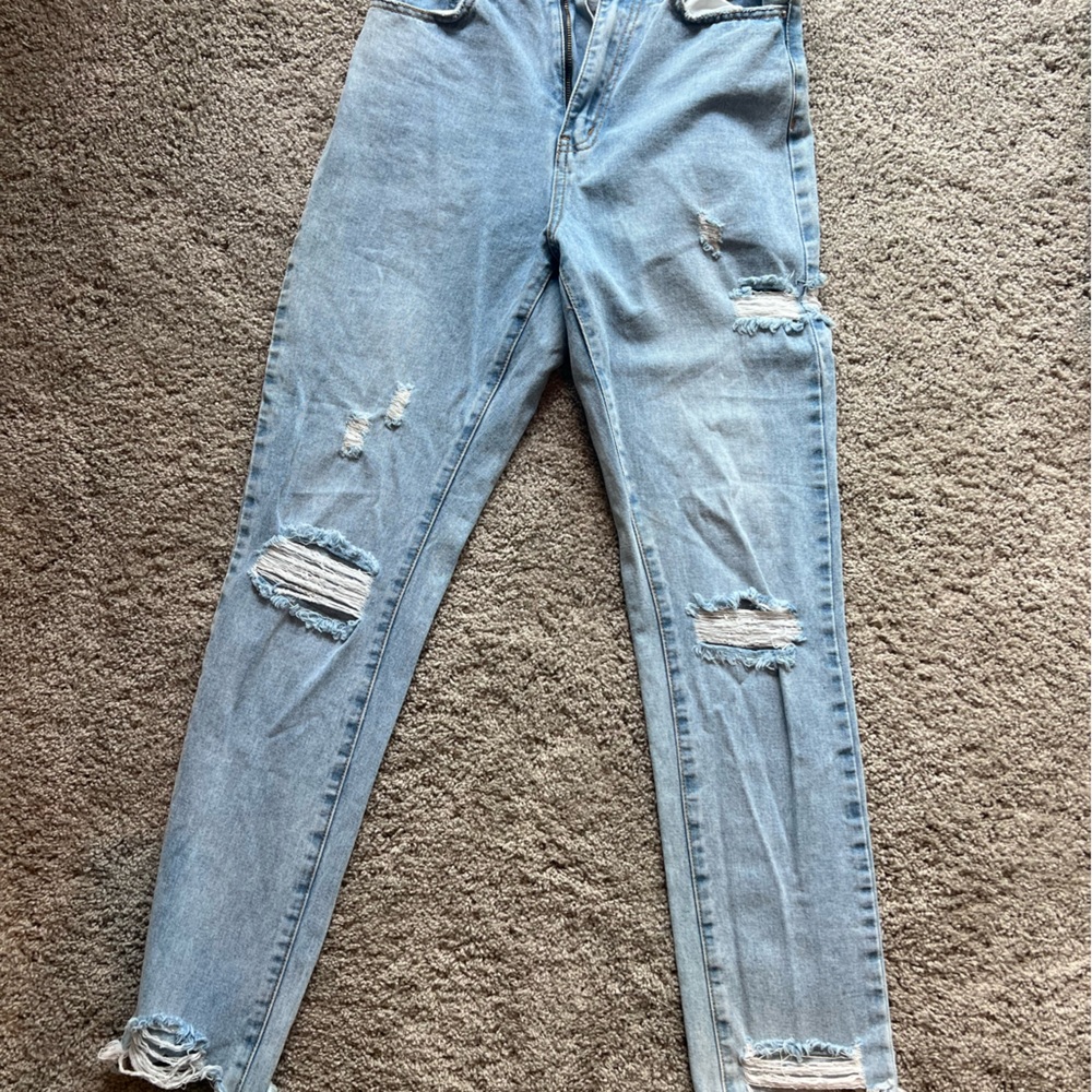 Distressed light wash jeans